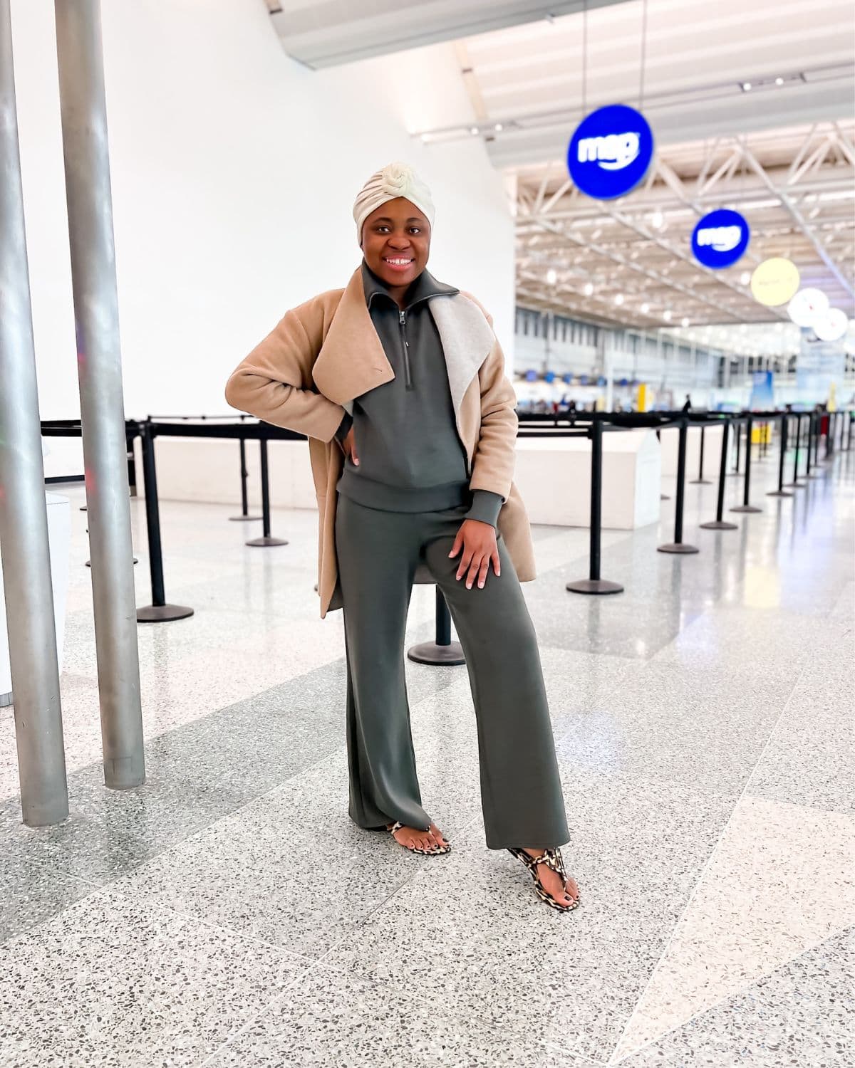 Louisa wearing Tory Burch Miller sandals. Airport style.