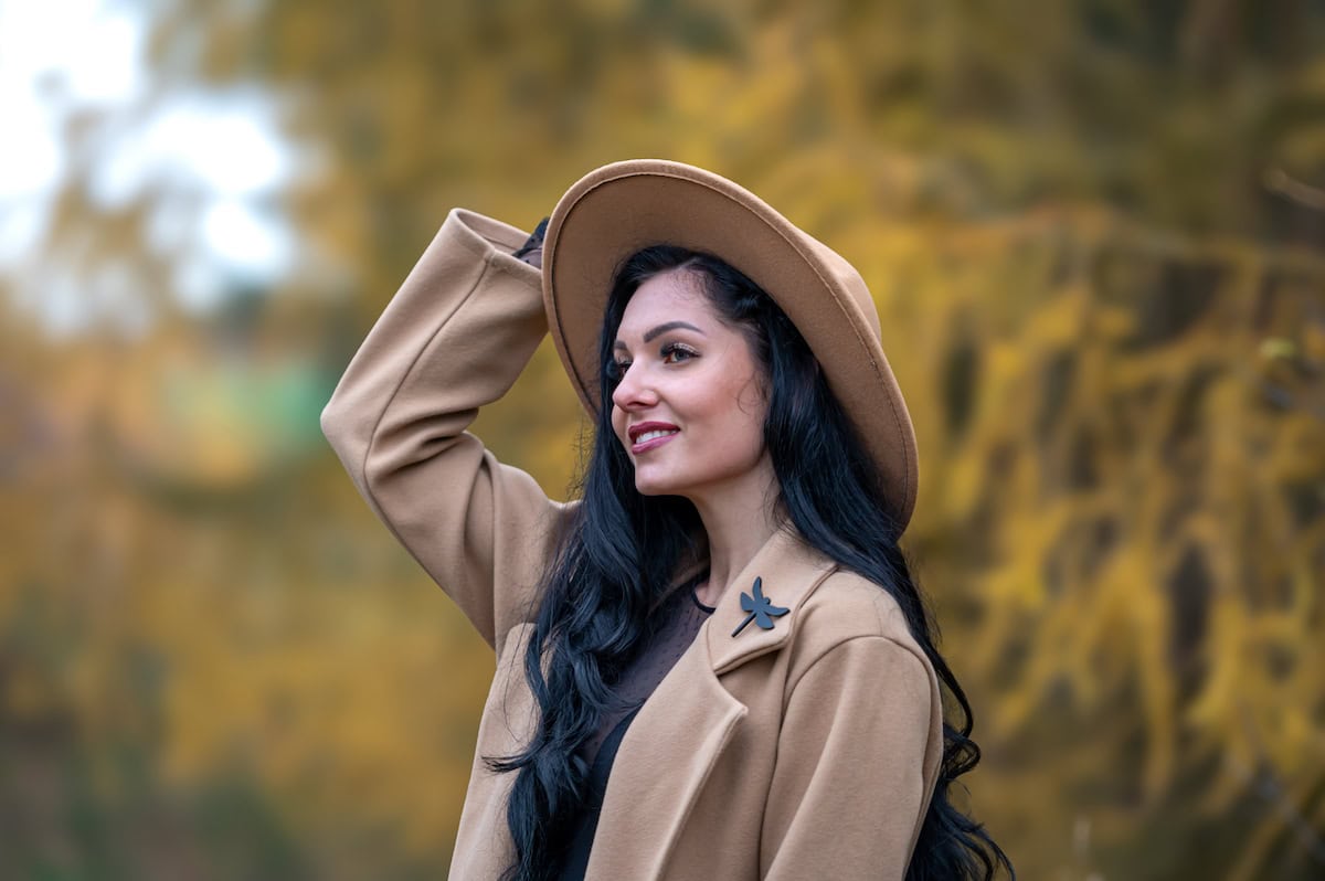 beautiful brunette girl in beige coat and hat posi 2023 11 28 20 38 04 utc 1