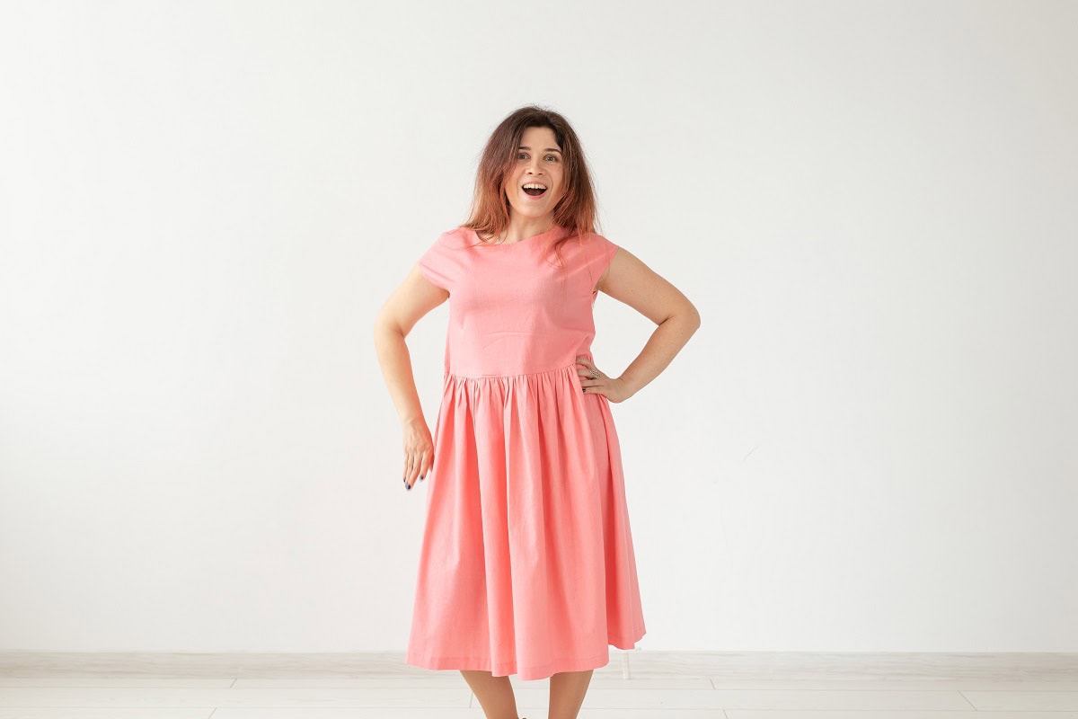 beautiful young cheerful woman in a long peach dre 2023 11 27 04 53 45 utc 1