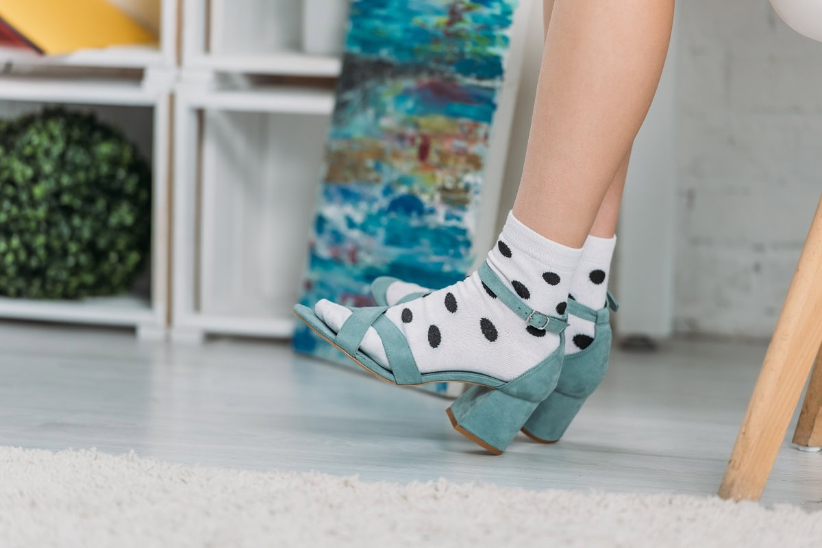 cropped view of trendy girl in dotted socks and sa 2024 11 09 10 48 15 utc