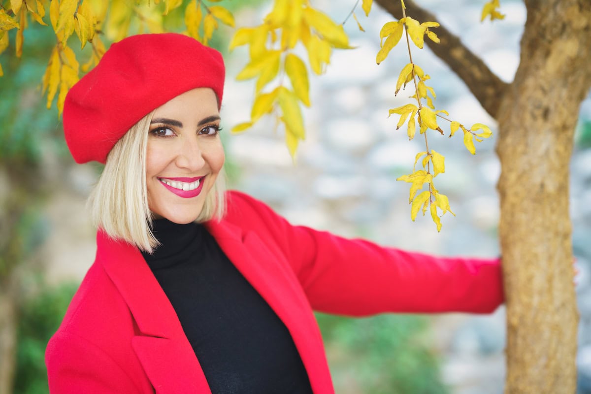 excited young trendy woman standing near autumn tr 2023 11 27 05 14 09 utc