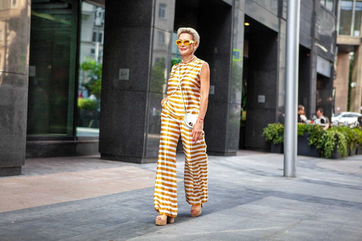 fashionable mature woman walking on city street in 2025 01 29 05 56 31 utc