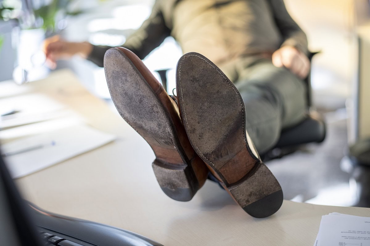 person with feet on desk in an office environment 2024 08 19 21 33 32 utc 1