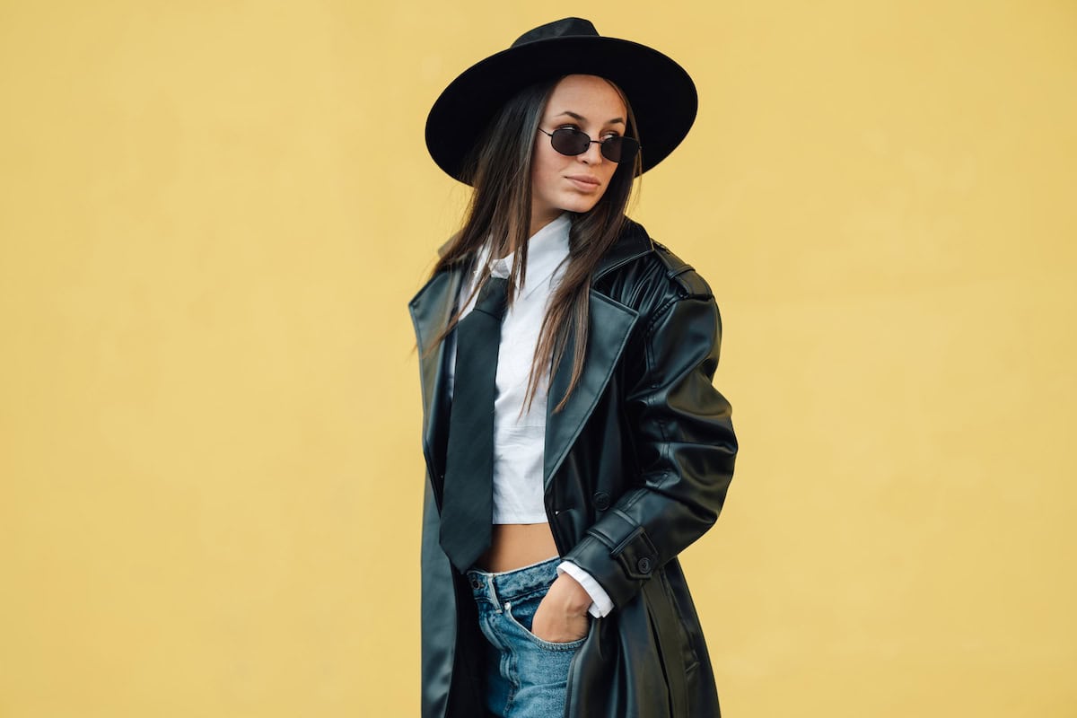 stylish woman wearing black hat sunglasses and t 2024 11 19 21 14 50 utc