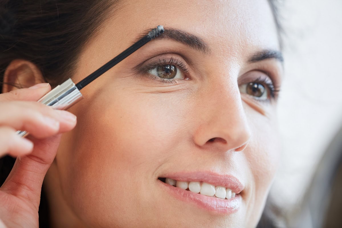 woman fixing eyebrows with gel 2023 11 27 04 50 35 utc