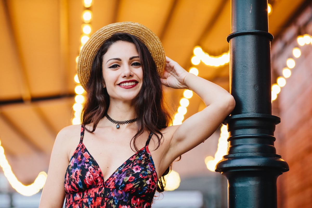 woman wearing dress with flower print and straw ha 2023 11 27 05 29 01 utc