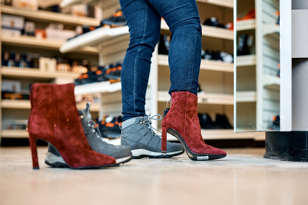 close up of woman buying new pair of shoes at shop 2024 12 13 18 23 23 utc