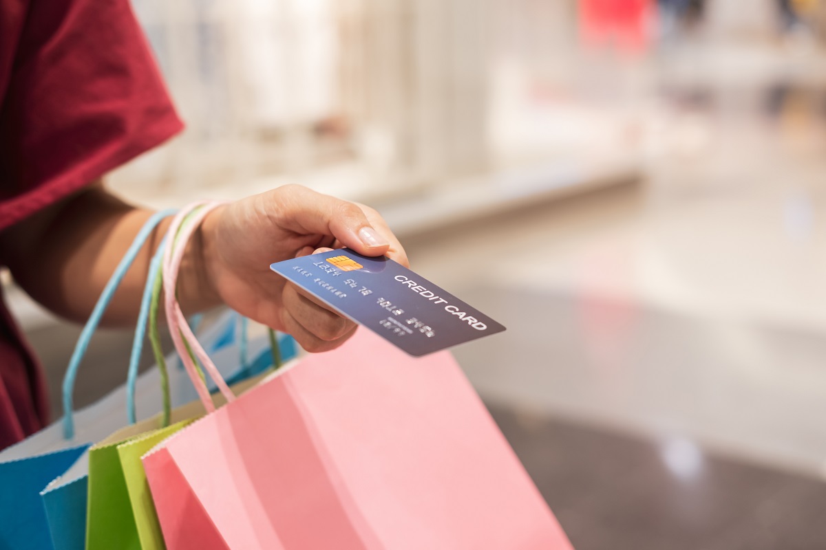 happy young asian woman holding credit card and co 2025 03 07 15 10 21 utc