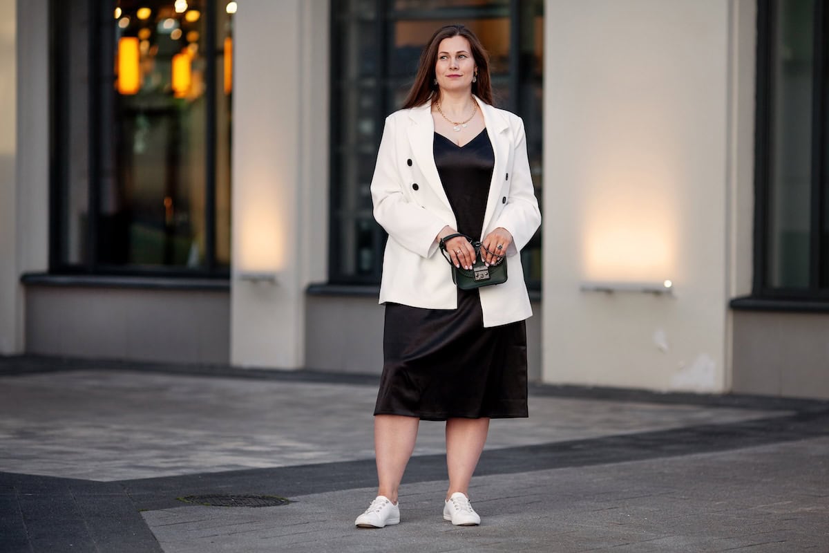 plus size young woman stands outdoors in urban set 2025 01 16 12 01 10 utc