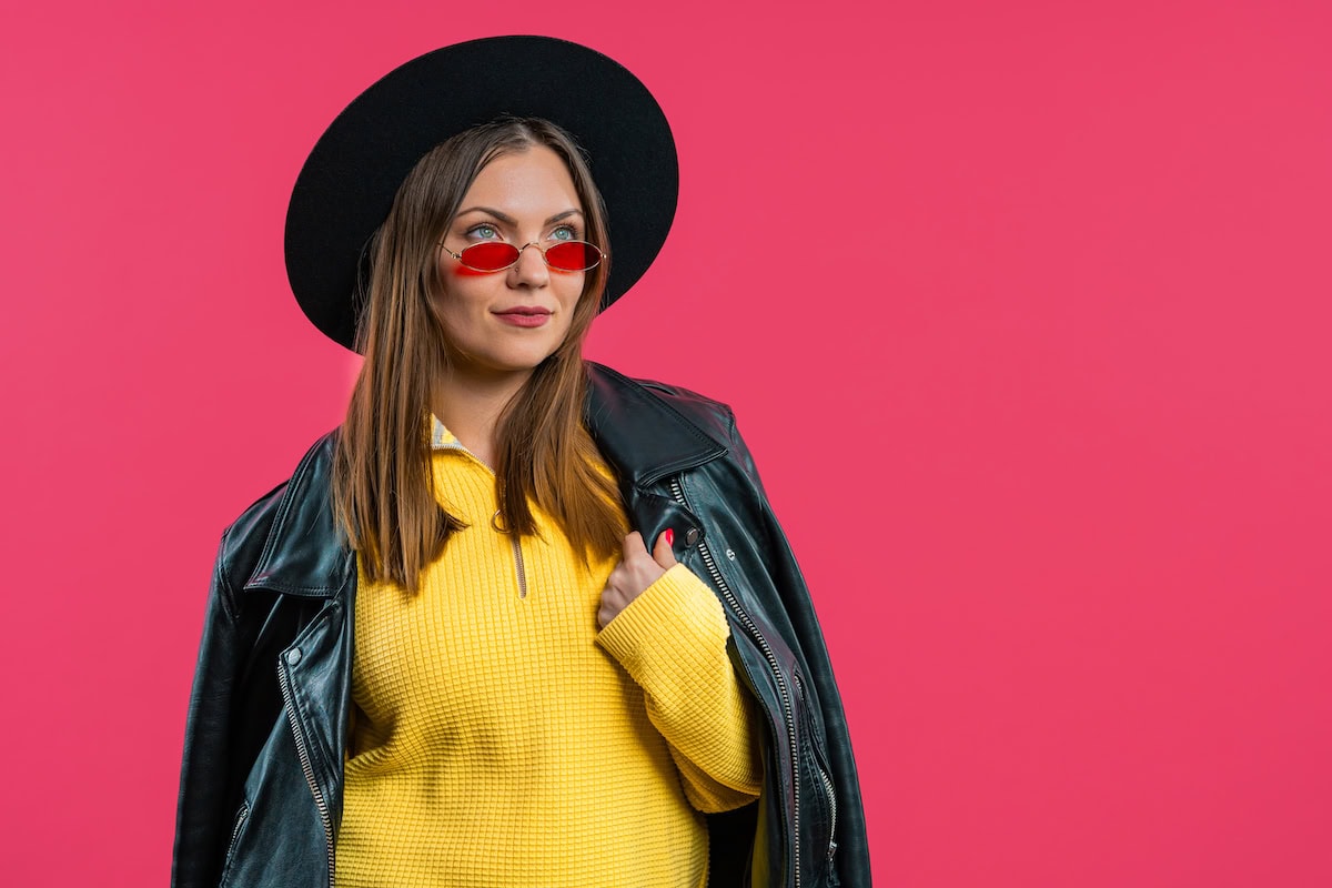 pretty stylish woman on pink background smiling l 2025 03 09 10 24 09 utc