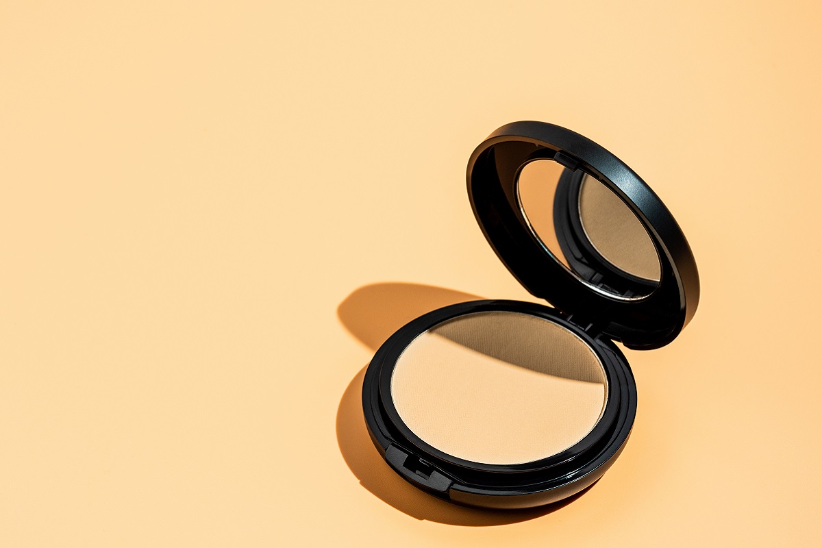 compact powder on yellow background copy space 2025 02 21 11 24 53 utc