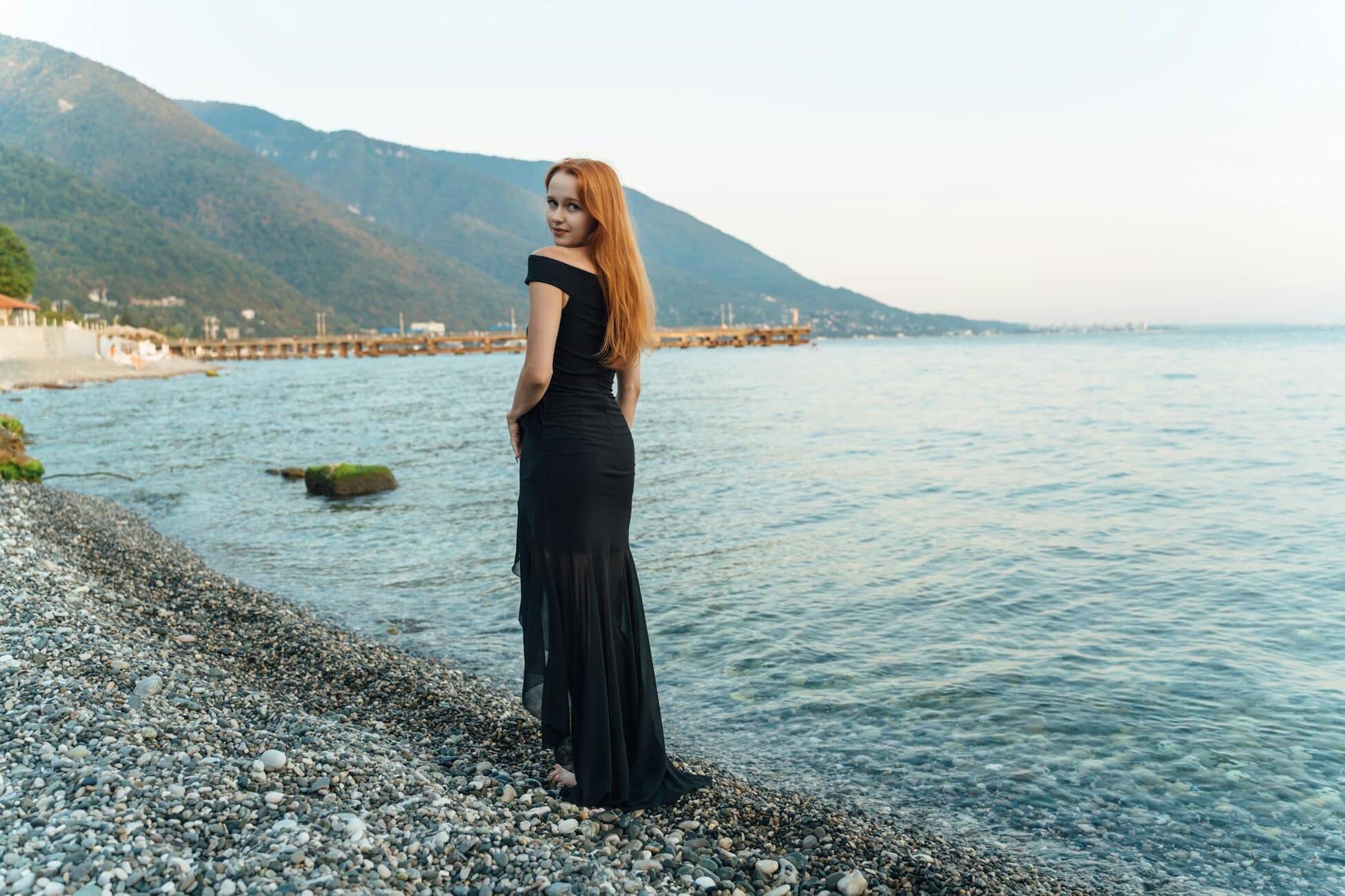 free photo of elegant woman on pebble beach in