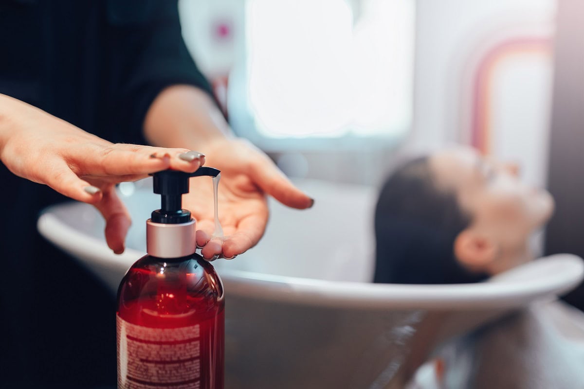 hairdresser washes customer hair with shampoo 2024 12 04 22 37 29 utc