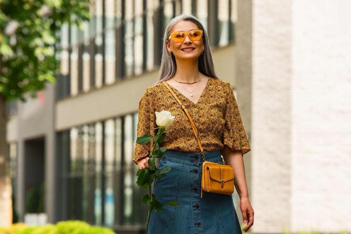 happy asian woman in denim skirt and patterned blo 2024 11 11 12 22 49 utc