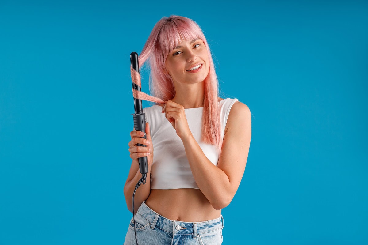 happy woman smiling at camera while styling pink l 2024 10 18 08 12 19 utc