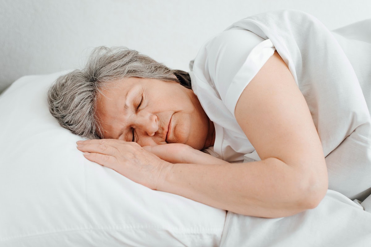 senior caucasian woman sleeps in bed in bedroom ly 2025 03 13 16 51 19 utc