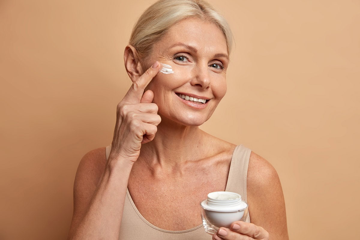 smiling tender woman holds jar of cream with anti 2025 01 24 02 37 29 utc