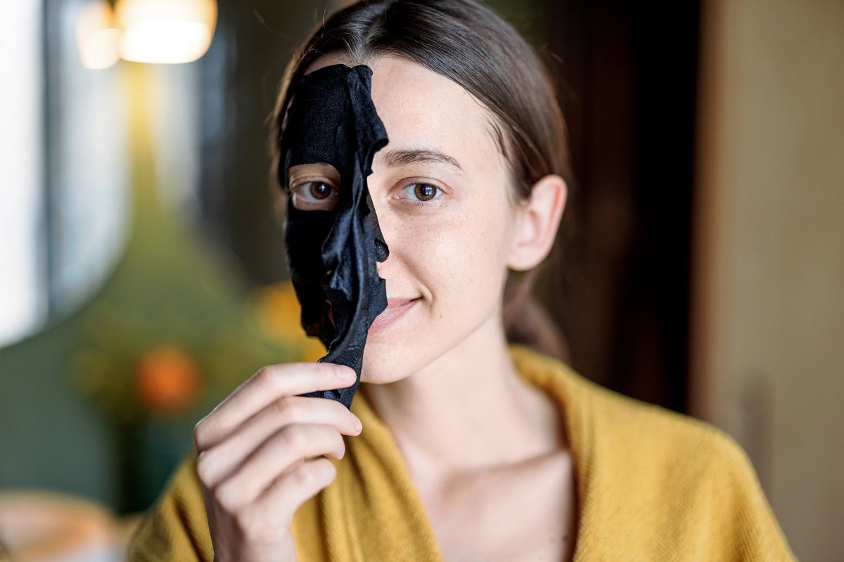 woman with cleansing black mask on her face 2025 03 17 04 27 40 utc