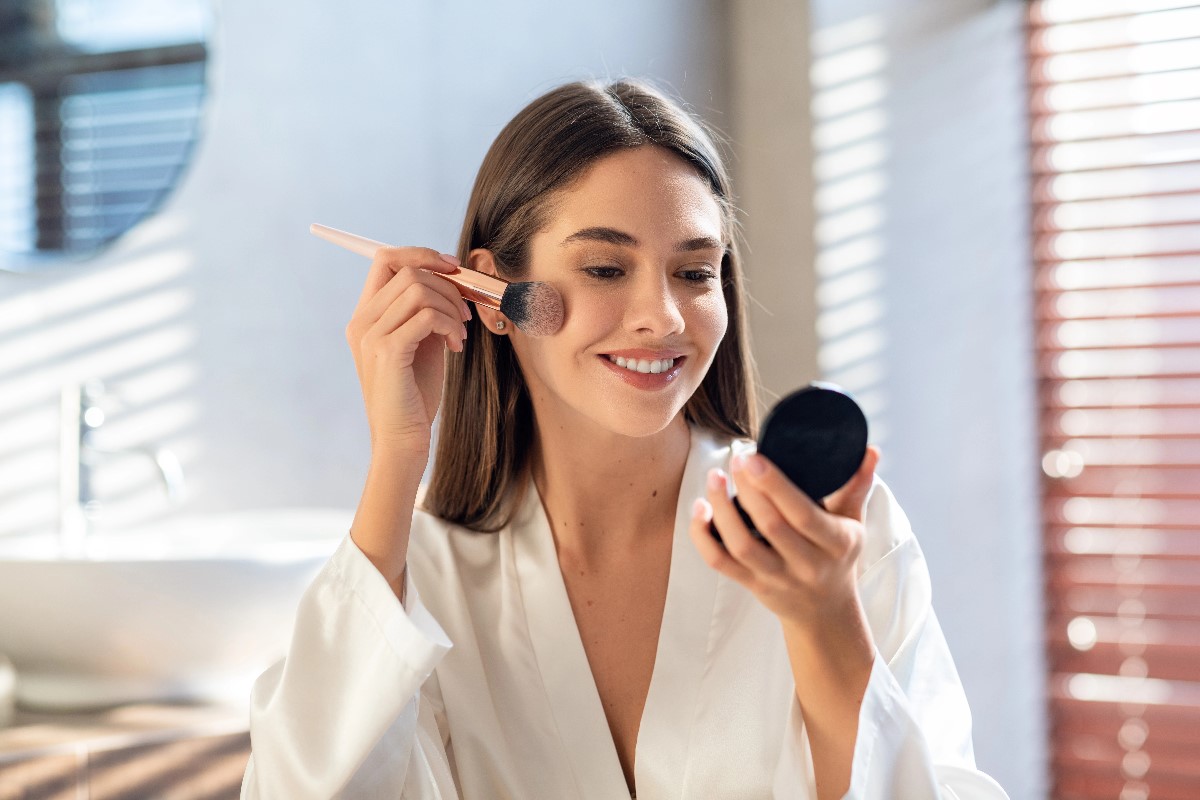 Woman using blush