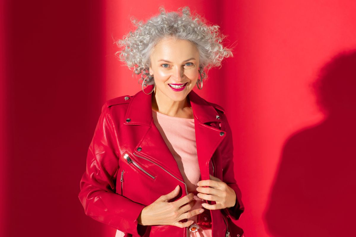 stylish woman with pink lips posing in red leather 2024 10 18 07 38 38 utc